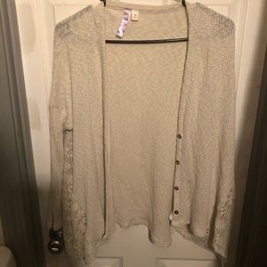 A cream colored cardigan